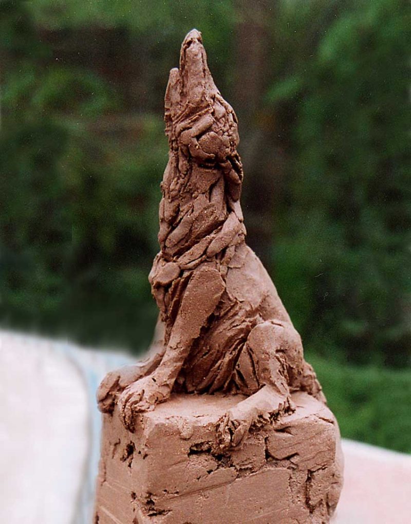 Wolf's Bane - Wolf howling on rock sculpture