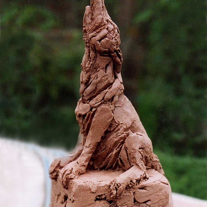 Wolf's Bane - Wolf howling on rock sculpture